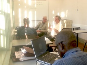 Bryan Rainey of Family Air, Ray Langlois of Oschner, Mike Murphy of Artisan Associates & Willie Williams of GBOB confer at the Heatload Workshop in June.